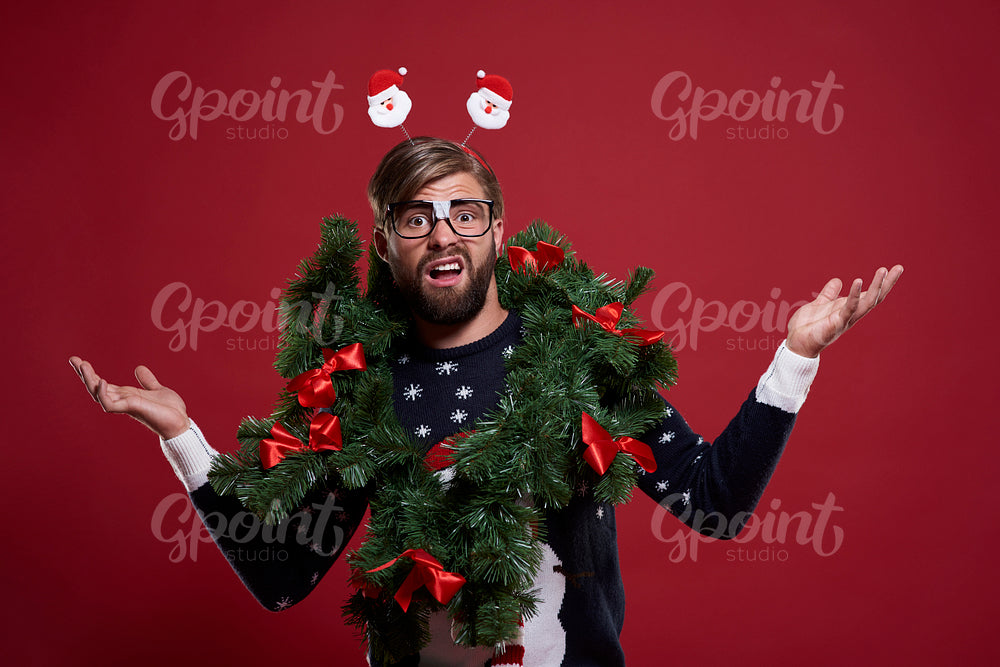 Man in embarrassing Christmas garland