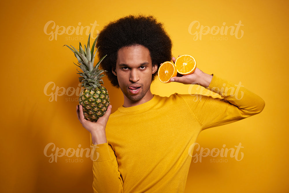 Flirty Afroamerican with exotic fruits