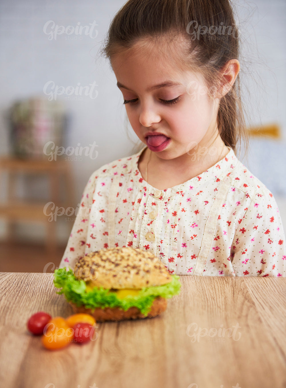 Disgusted child looking at healthy sandwich
