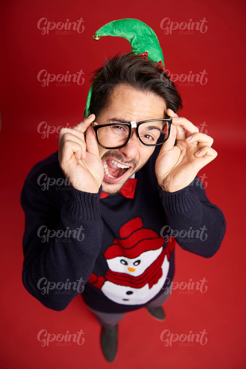 High angle view of funny nerd man with glasses