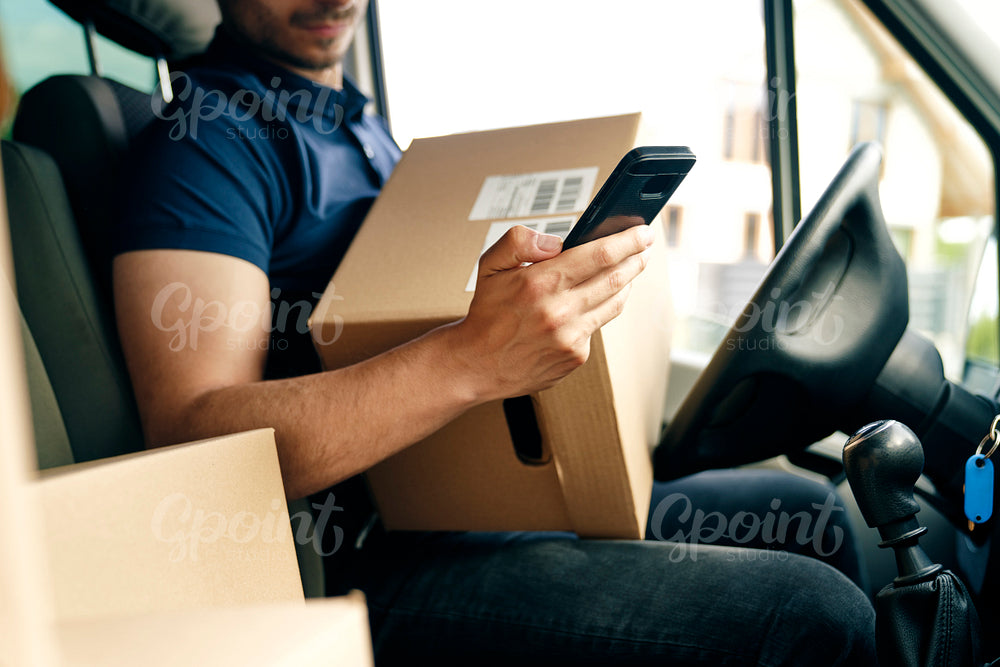 Close up of checking a package using portable information device
