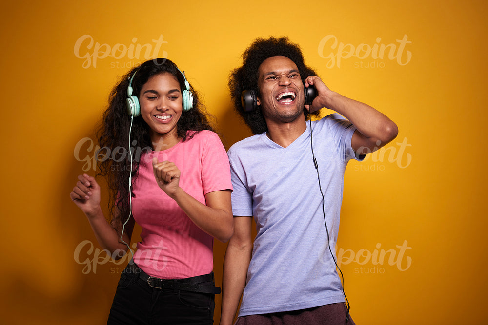 Couple having fun while listening to music