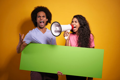 Screaming couple with long chroma key copy space