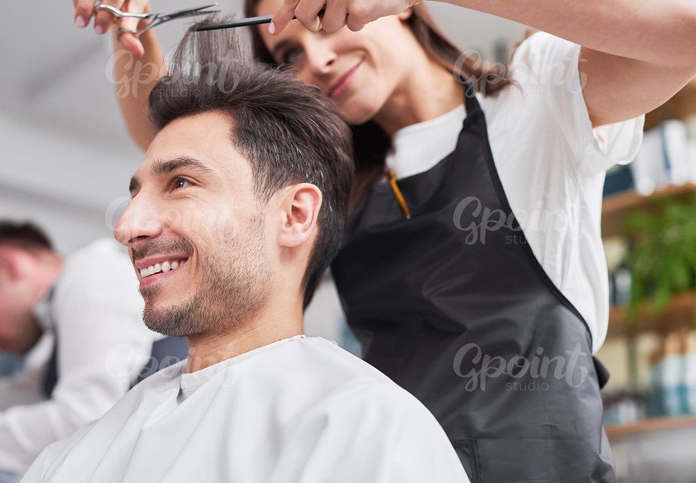 Close up of man has cutting hair at the hairstylist