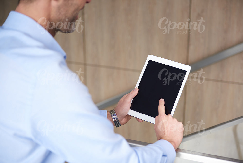 Browsing digital tablet in the office