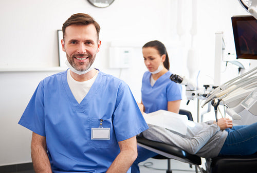 Portrait of smiling male dentist in dentist's clinic