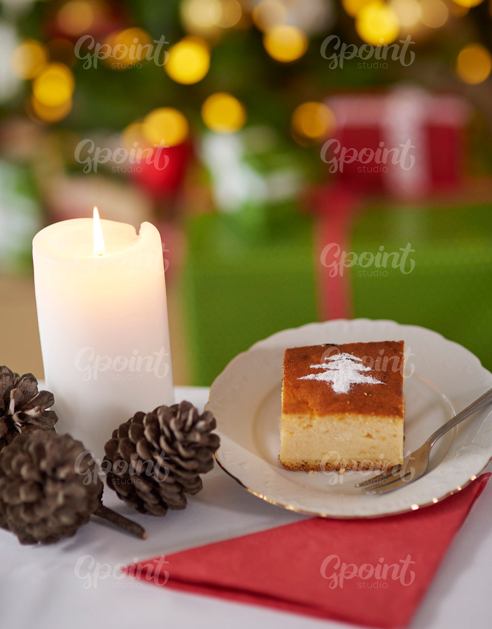 Sweet cake and Christmas tree in the background