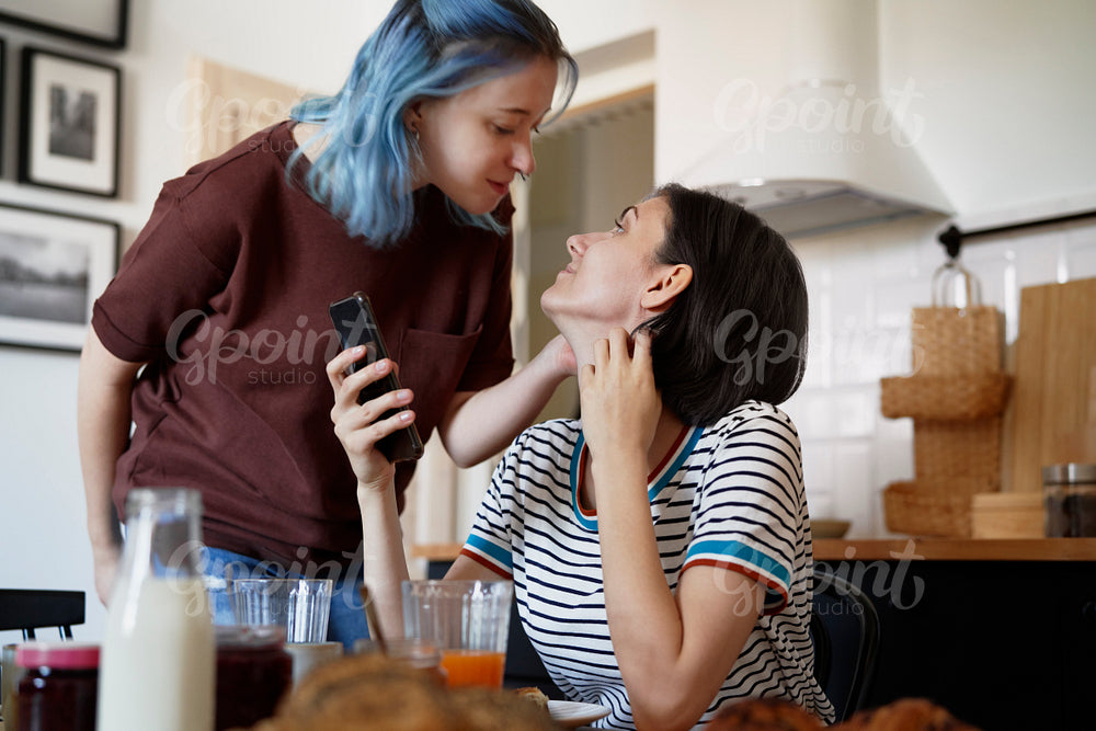 Happy lesbian couple in the kitchen