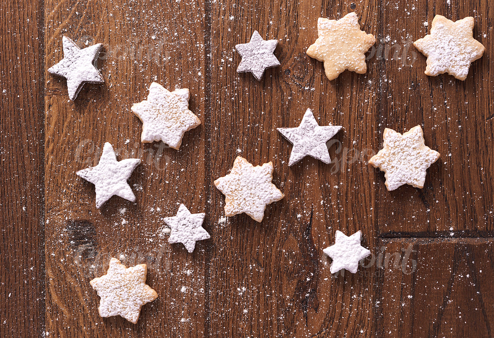 Star shaped gingerbread cookies with powdered sugar