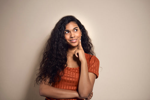 Mixed race woman thinking about something