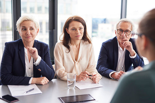 Business people having a conversation at conference table