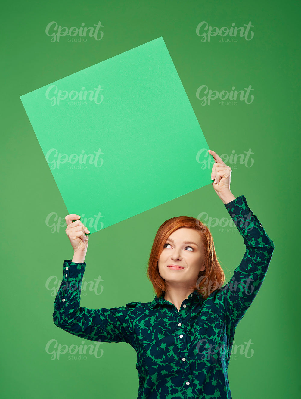 Happy woman holding banner with copy space