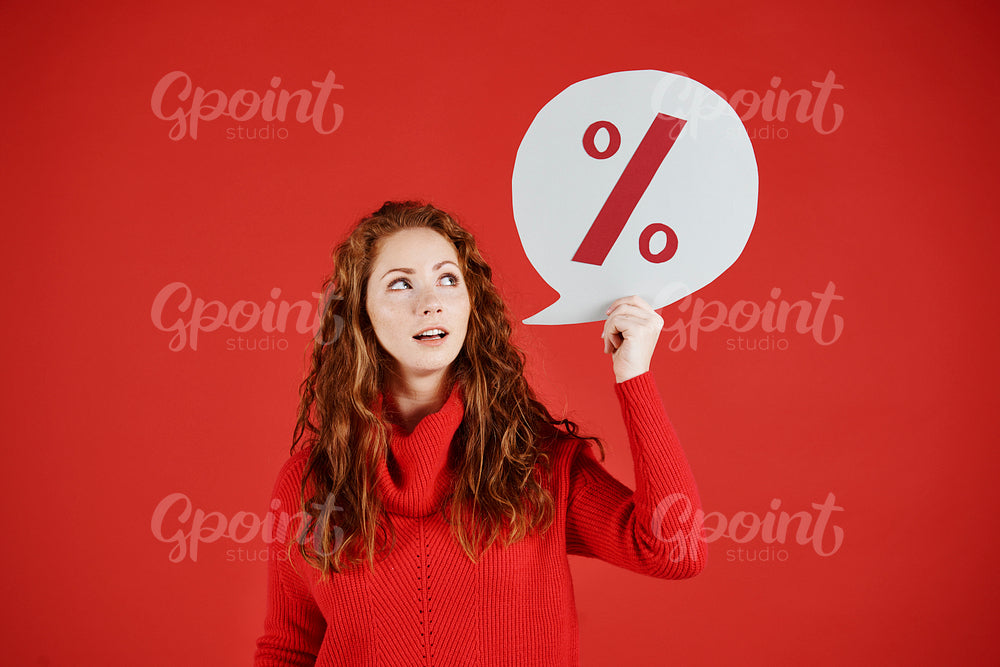 Woman showing banner of winter sale