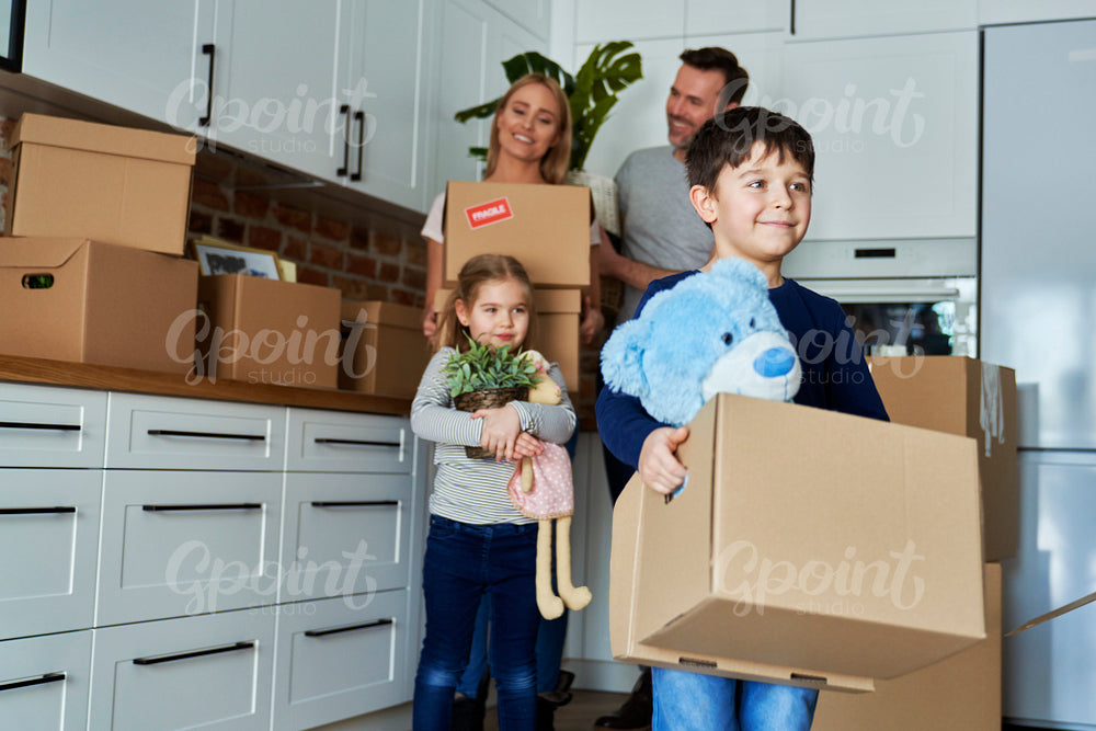 Smiling family moving to a new home