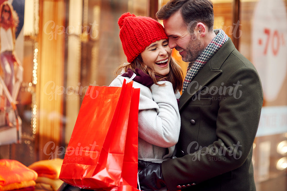 Romantic moment of couple during Christmas shopping