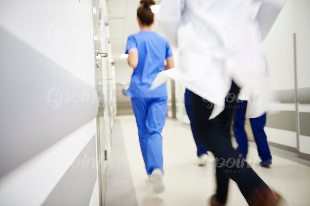 Team of doctors running in a hurry