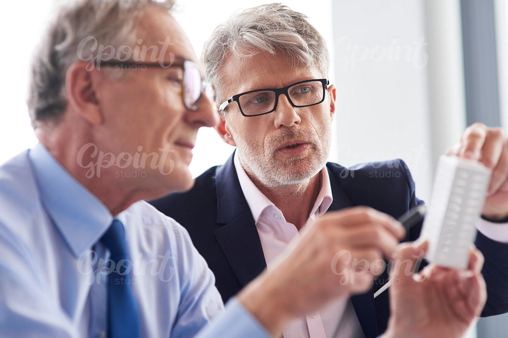 Two mature businessman discussing business plans