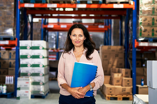 Portrait of caucasian mature woman in warehouse