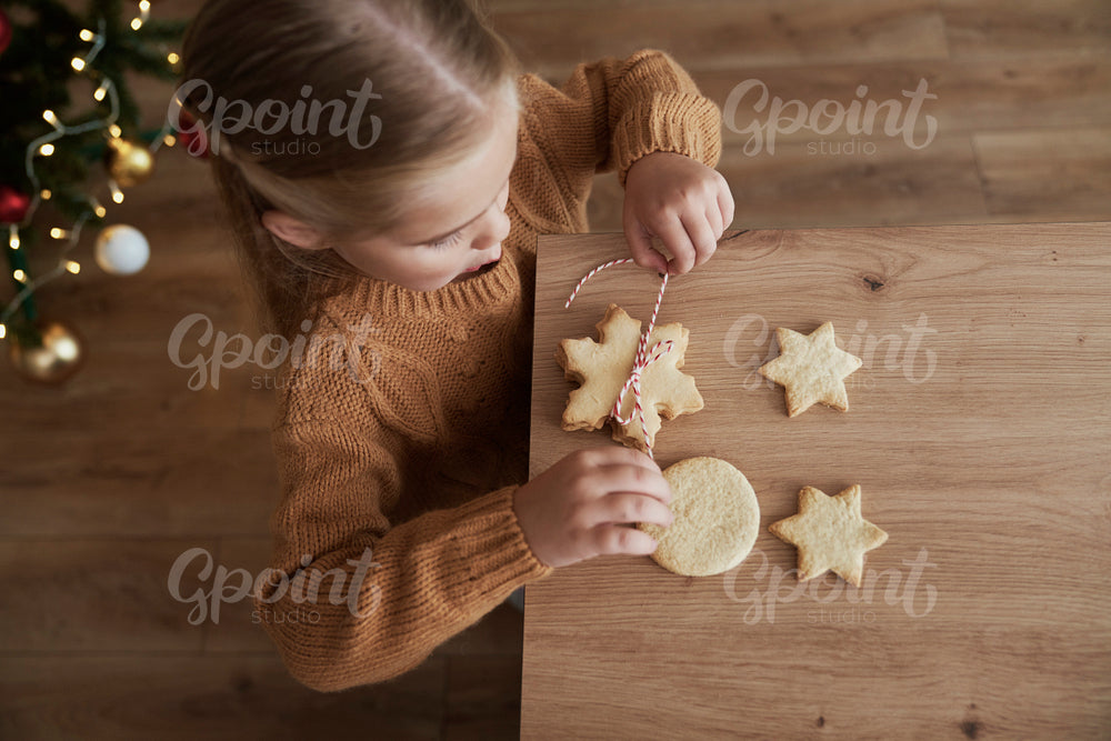 Top view of girl packing cookies for Santa Claus