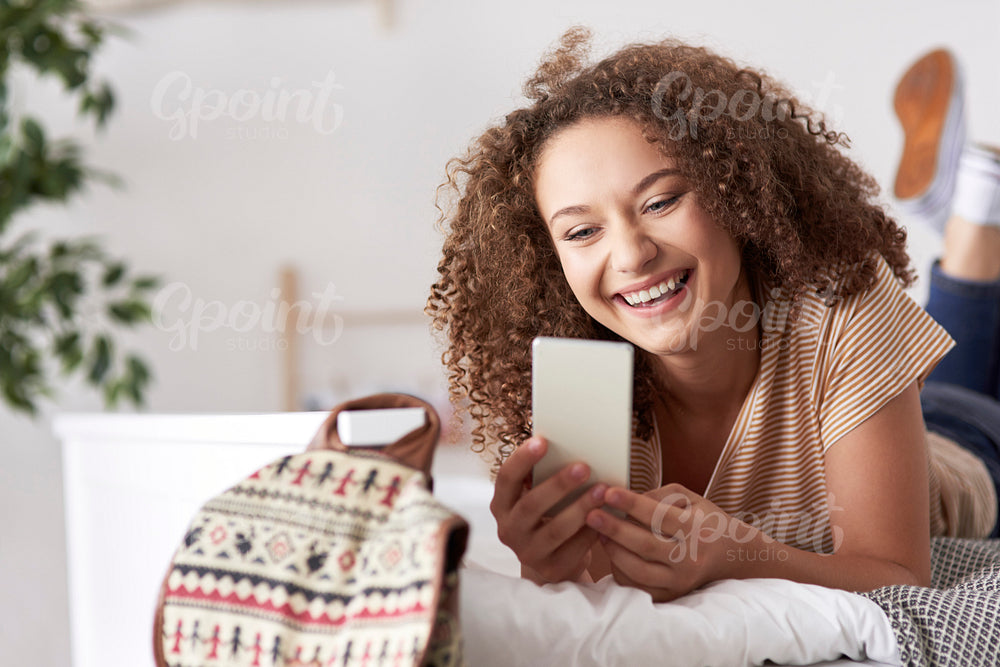 Happy teenage girl making a selfie