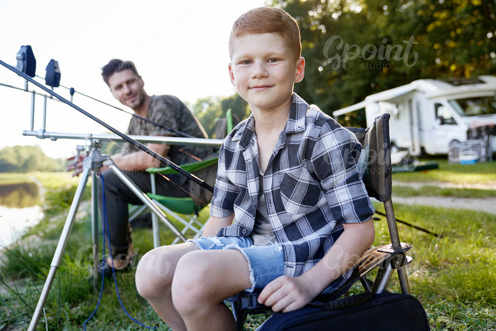 Portrait of father and son at fishing time