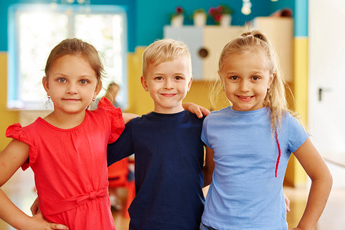 Portrait of three smiling children in the preschool