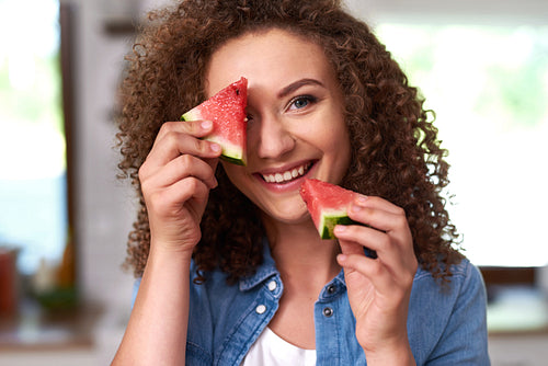 Young woman with a slice of watermelon
