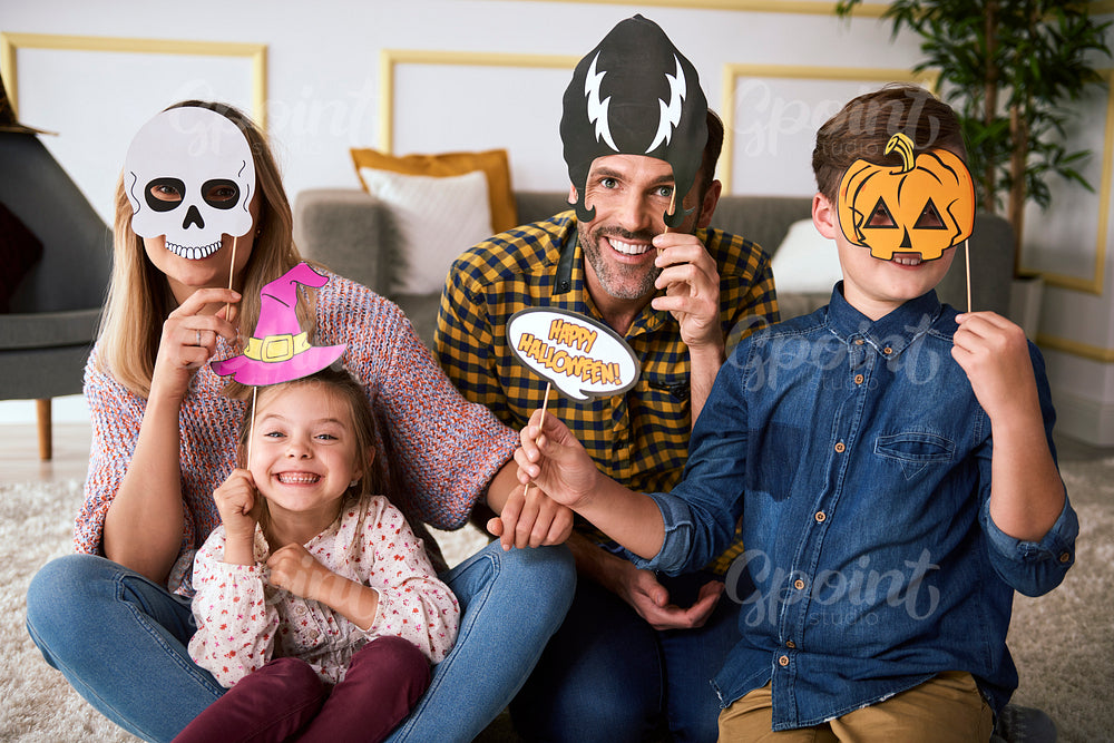 Happy family spending Halloween together at home