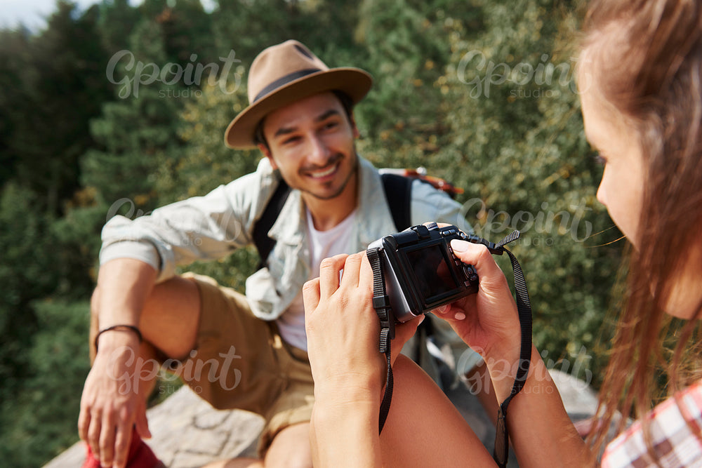 Backpackers using technology during hiking trip
