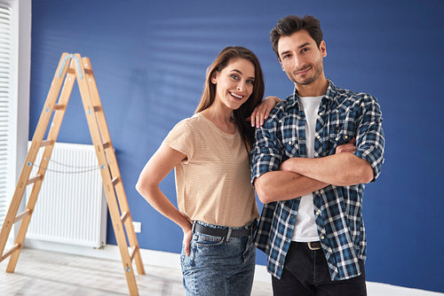 Portrait of couple ready to renovate their house
