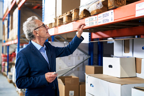 Caucasian leader in mature age working at warehouse