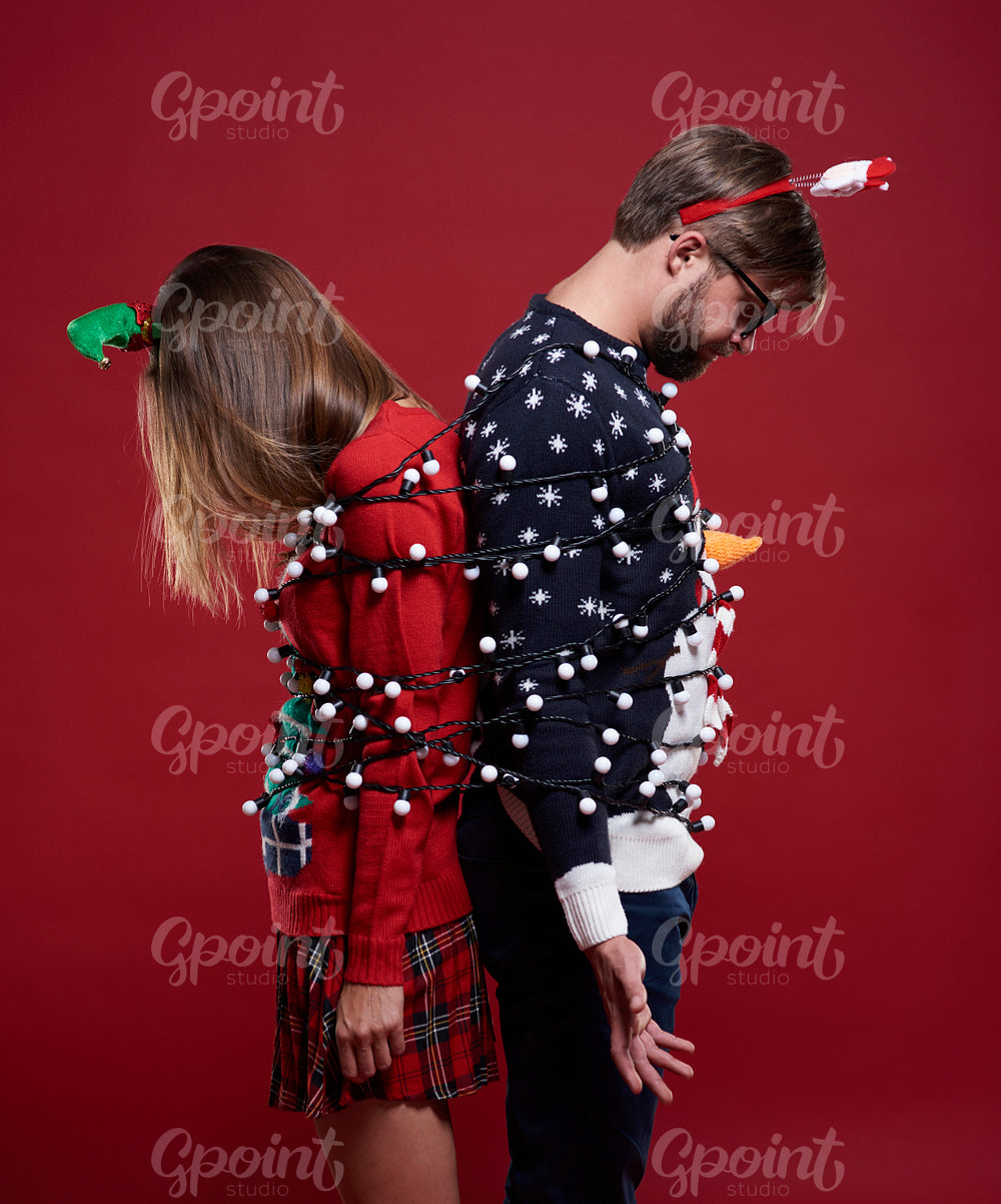 Couple trapped in fairy lights