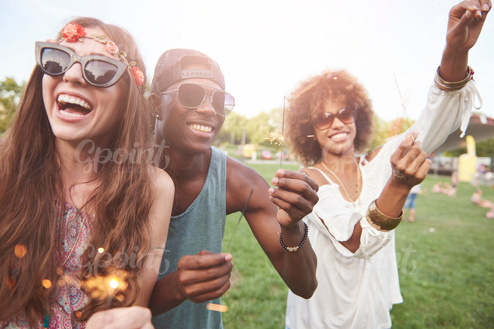 Young and happy people with sparklers