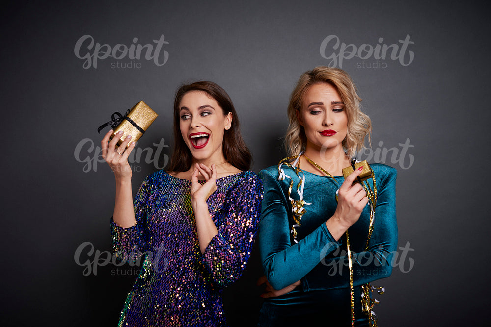 Women holding gifts in different mood