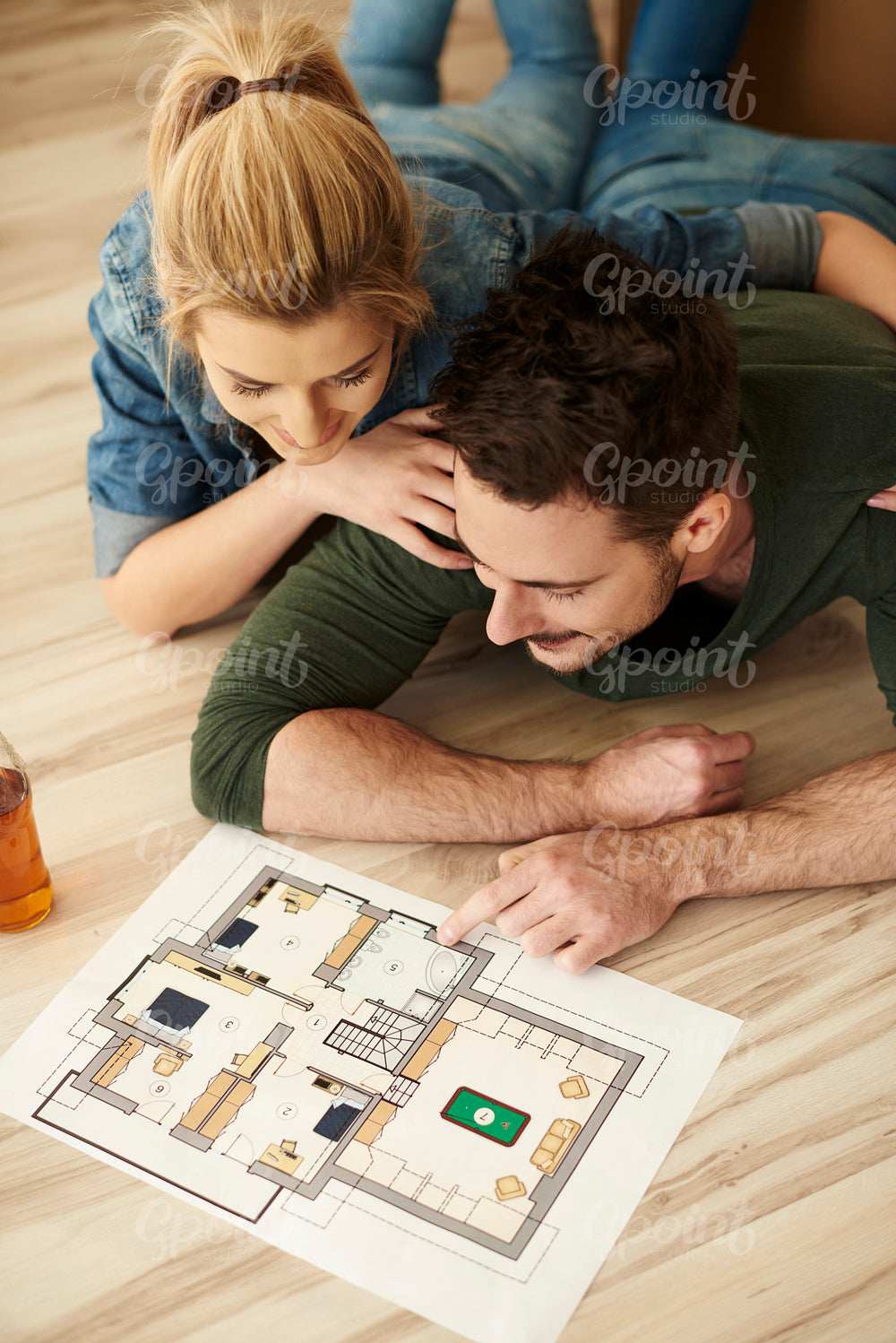 Couple looking at paint swatches and floorplan
