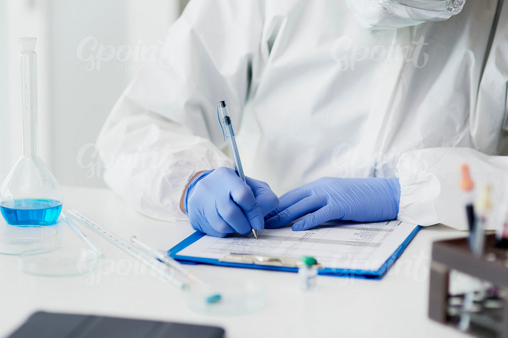 Technician making notes of medical exam
