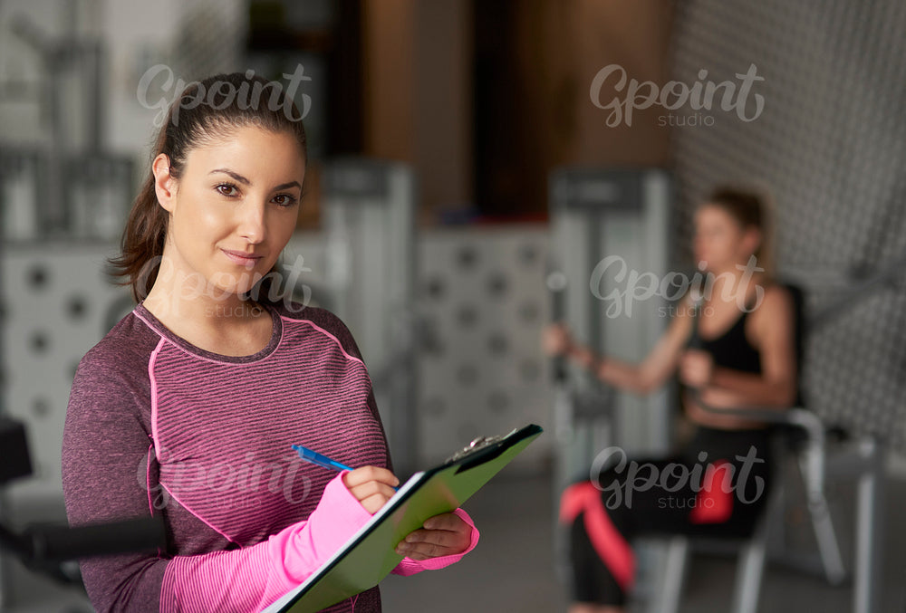 Portrait of female coach at the gym