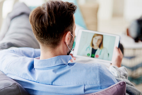 Man having video conference with a doctor