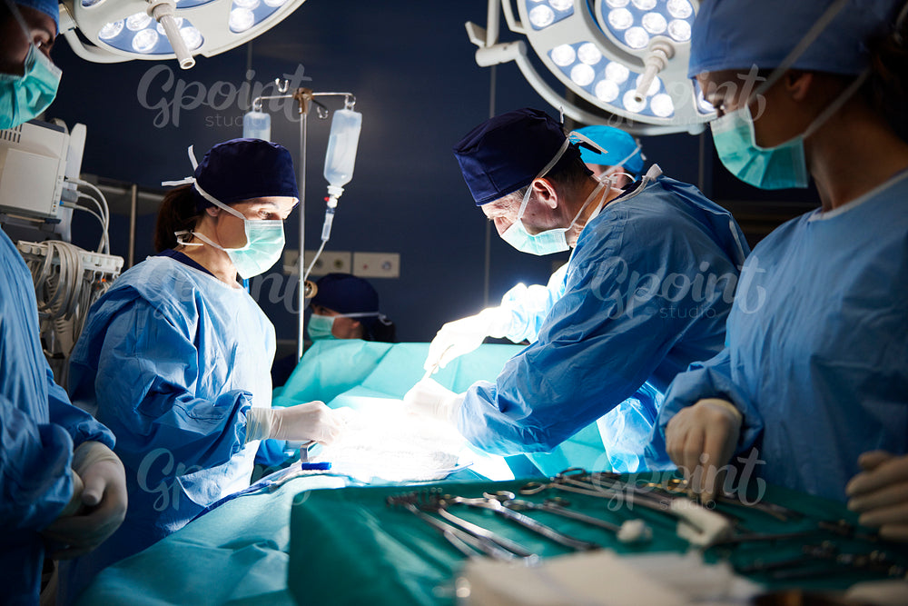 Busy surgeons during difficult operation