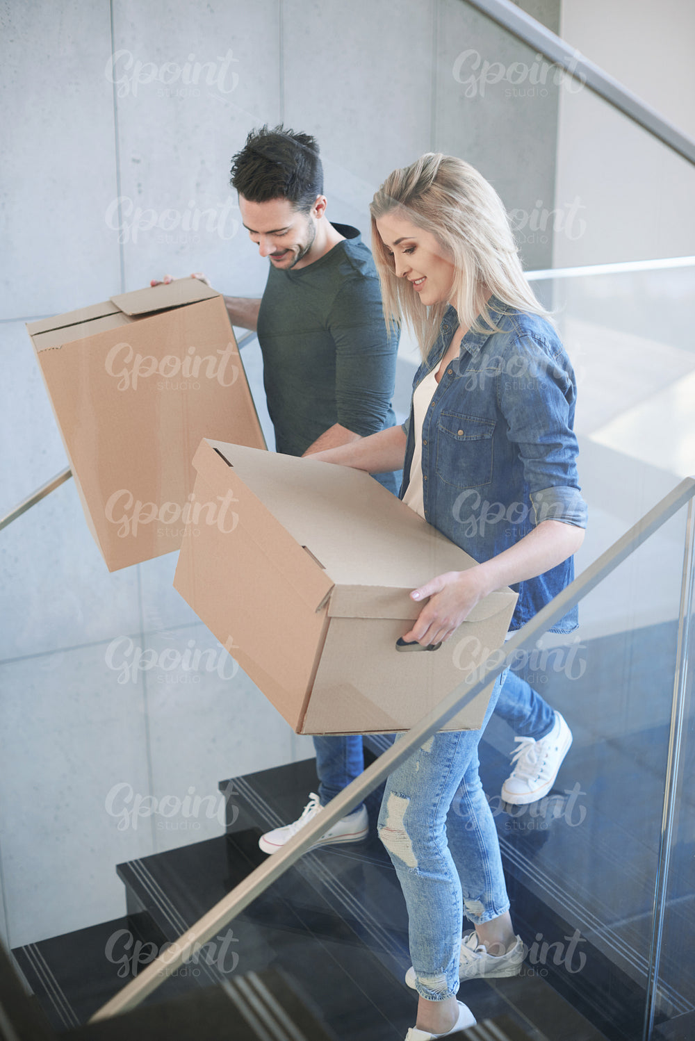 Excited couple moving  from the apartment