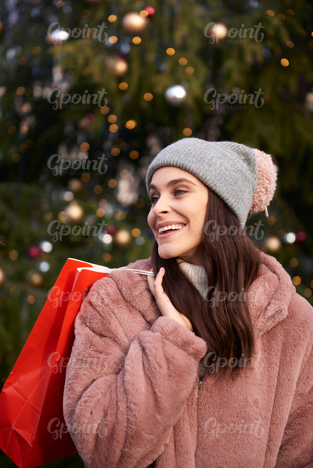 Woman with shopping bag on Christmas market