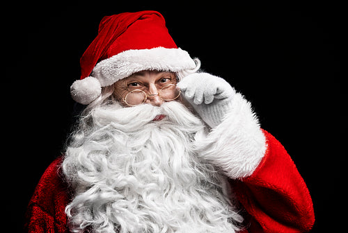 Portrait of cheerful santa claus with eyeglasses