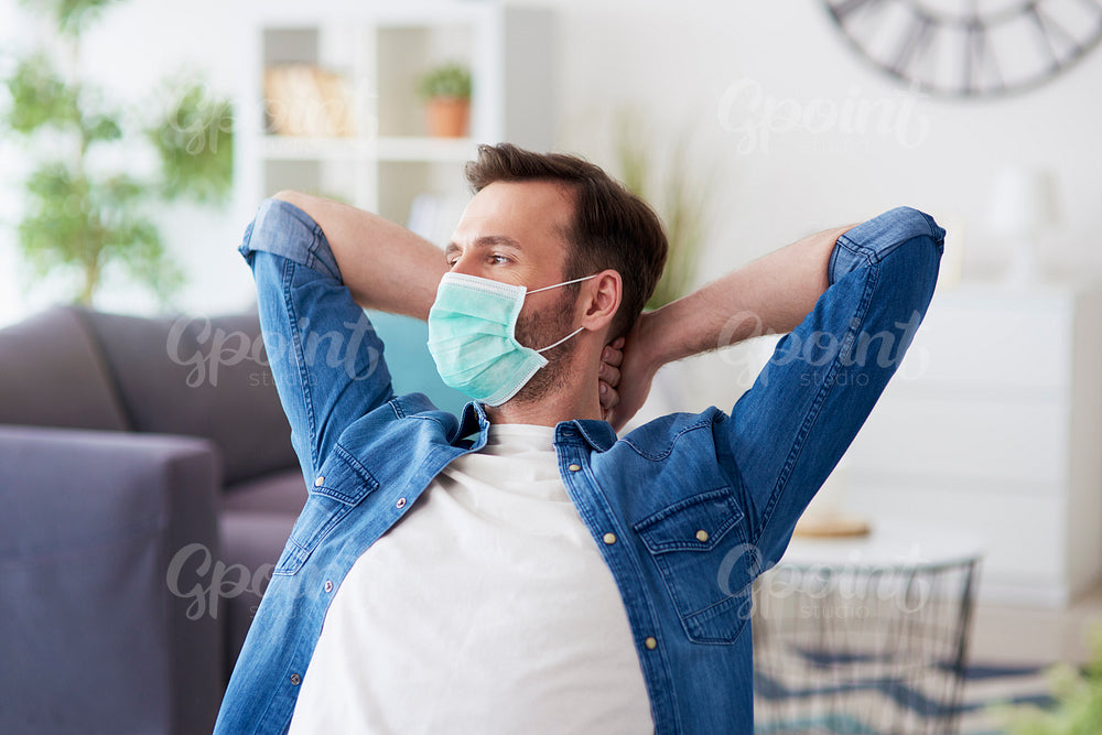 Man at home in protective mask