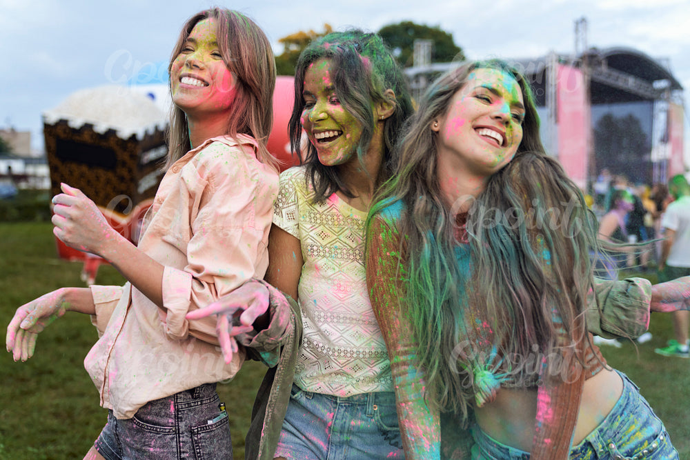 Group of multiracial friends have fun at Holi Festival 