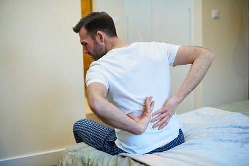 Rear view of man suffering from a backache