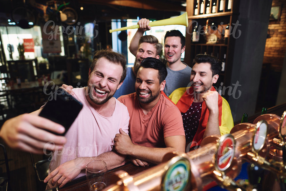 Group of male friends making a selfie