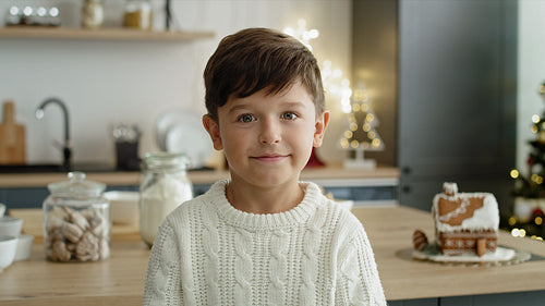 Portrait video of little boy in the kitchen