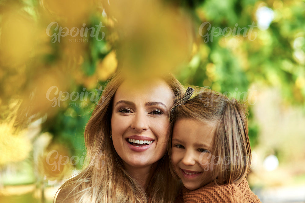 Portrait of happy mother and her little daughter