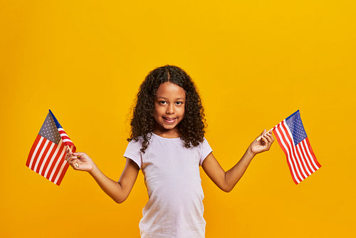 African girl waving American flags
