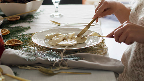 Woman eating dumplings at the Christmas Eve
